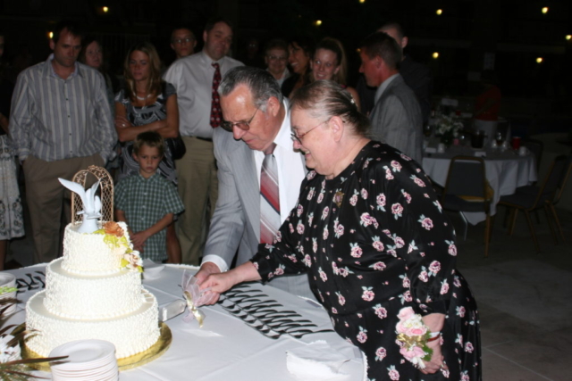 cutting cake 50th anniversary