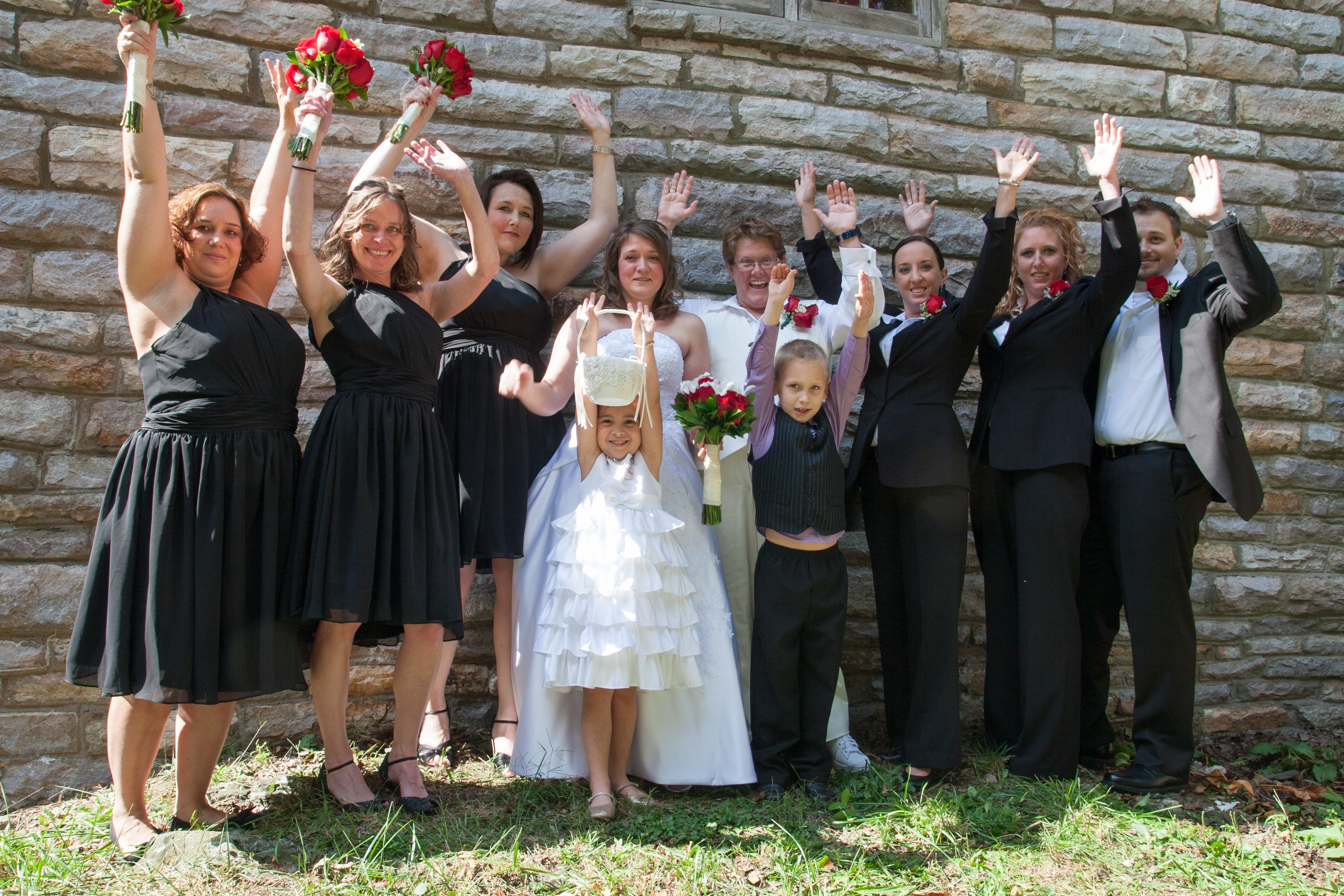 Wedding Party with Raised Hands
