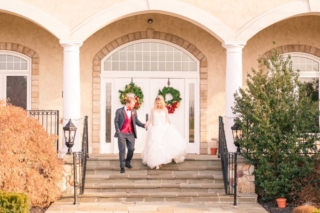 Winter wedding couple descend stairs