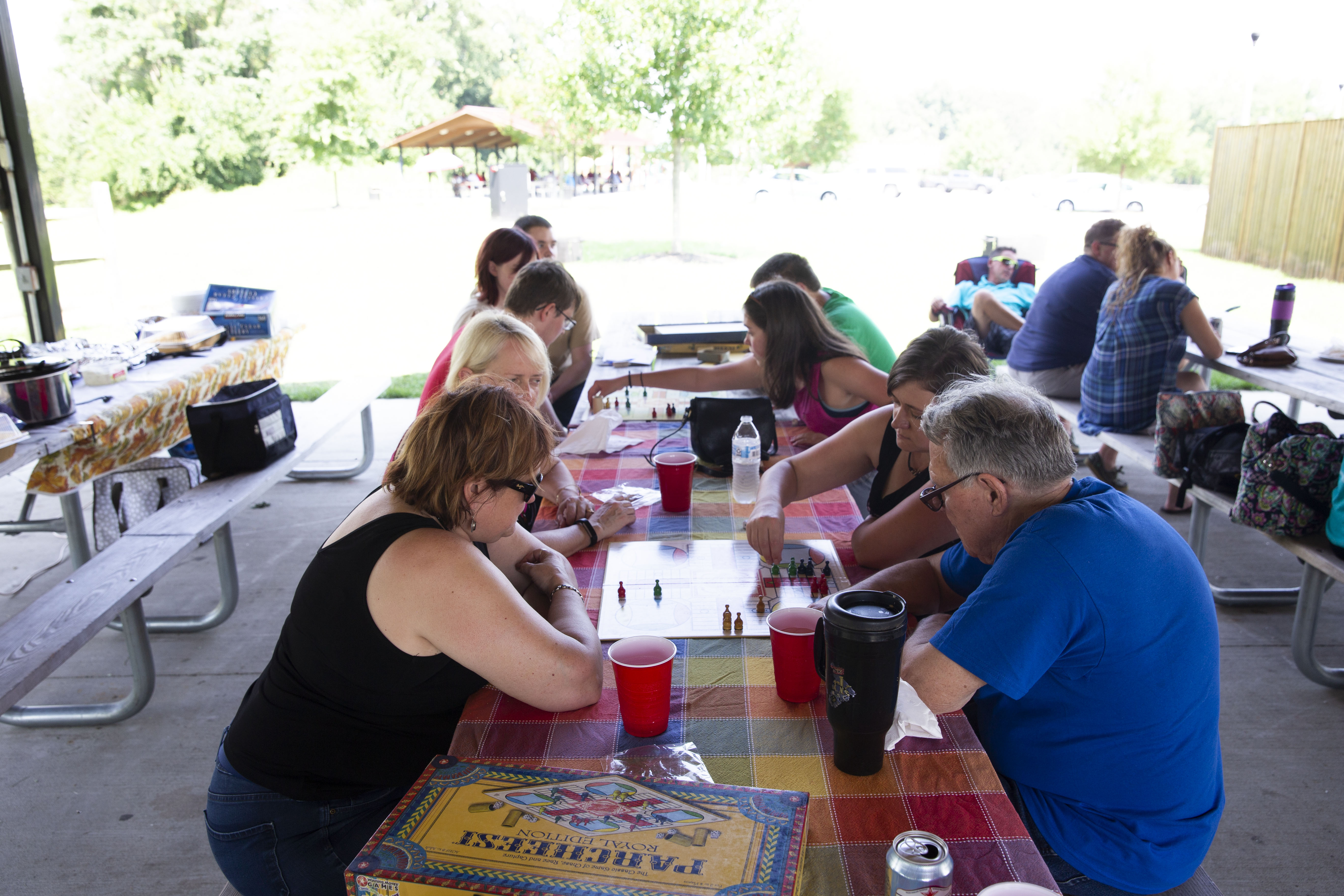 Family members playing table games at a family reunion